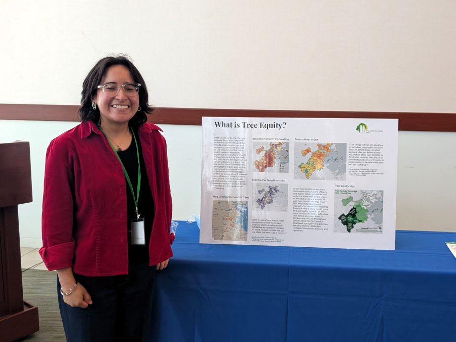 Woman standing in front of a poaster at a conference